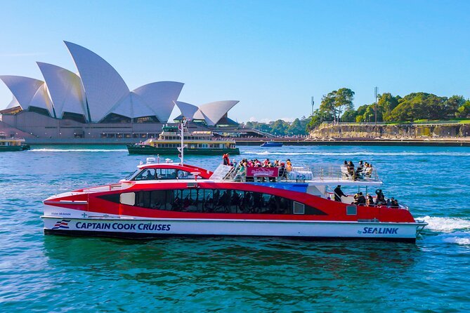 The iconic Sydney Opera House and Harbor Bridge on a sunny day.